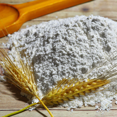 Bulk flour with wheat stalks
